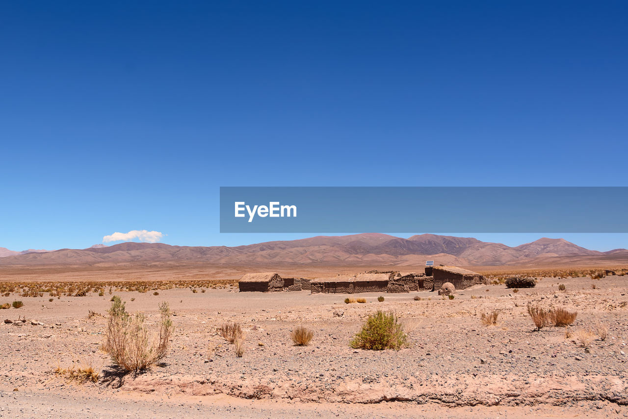 Scenic view of desert against clear sky