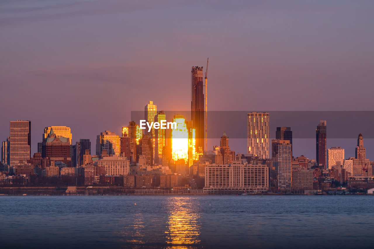 Sunset clouds moving over brooklyn downtown with new construction building