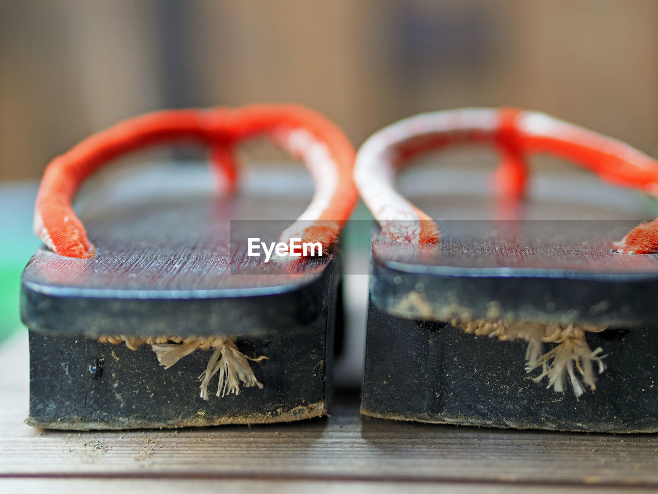 Close-up of geta sandal on hardwood floor at home