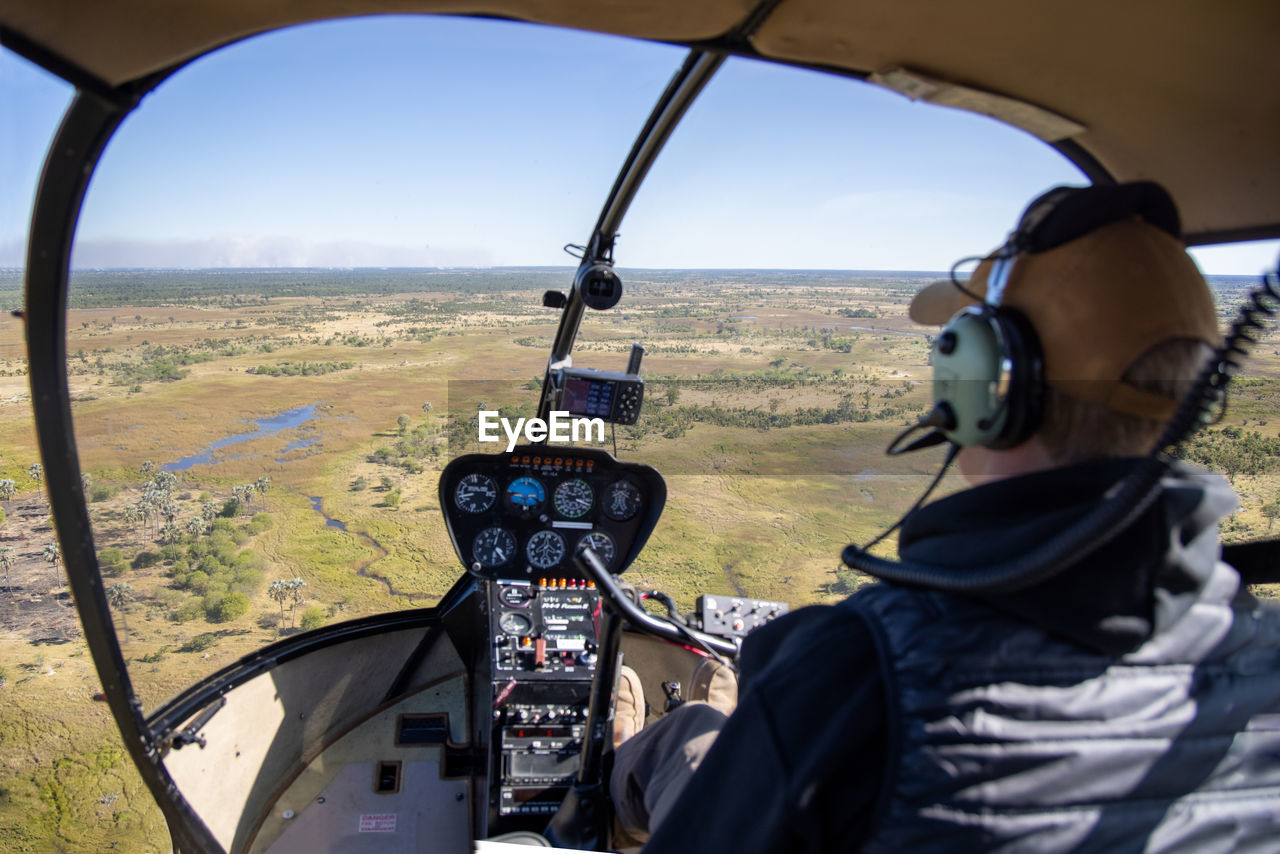 View from helicopter during flight over african steppe on sunny day