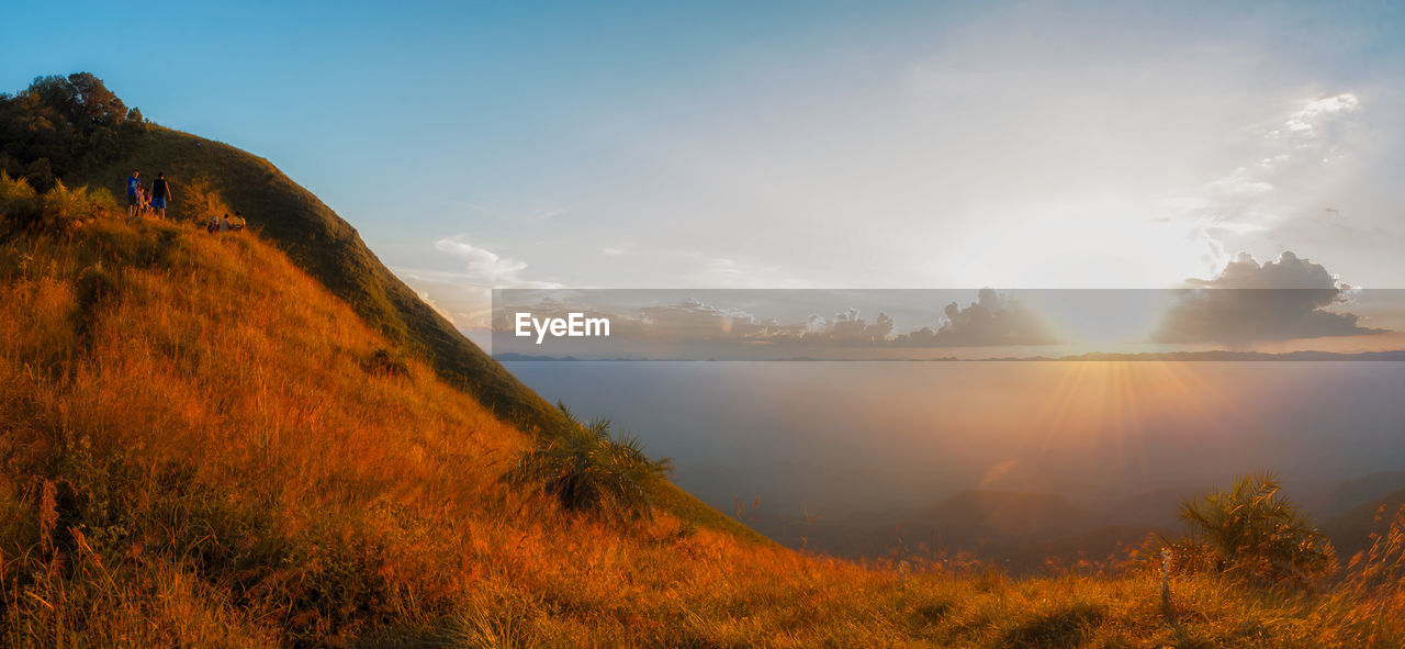 Scenic view of landscape against sky during sunset