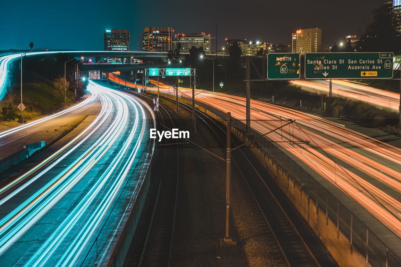 High angle view of light trails on multiple lane highway at night