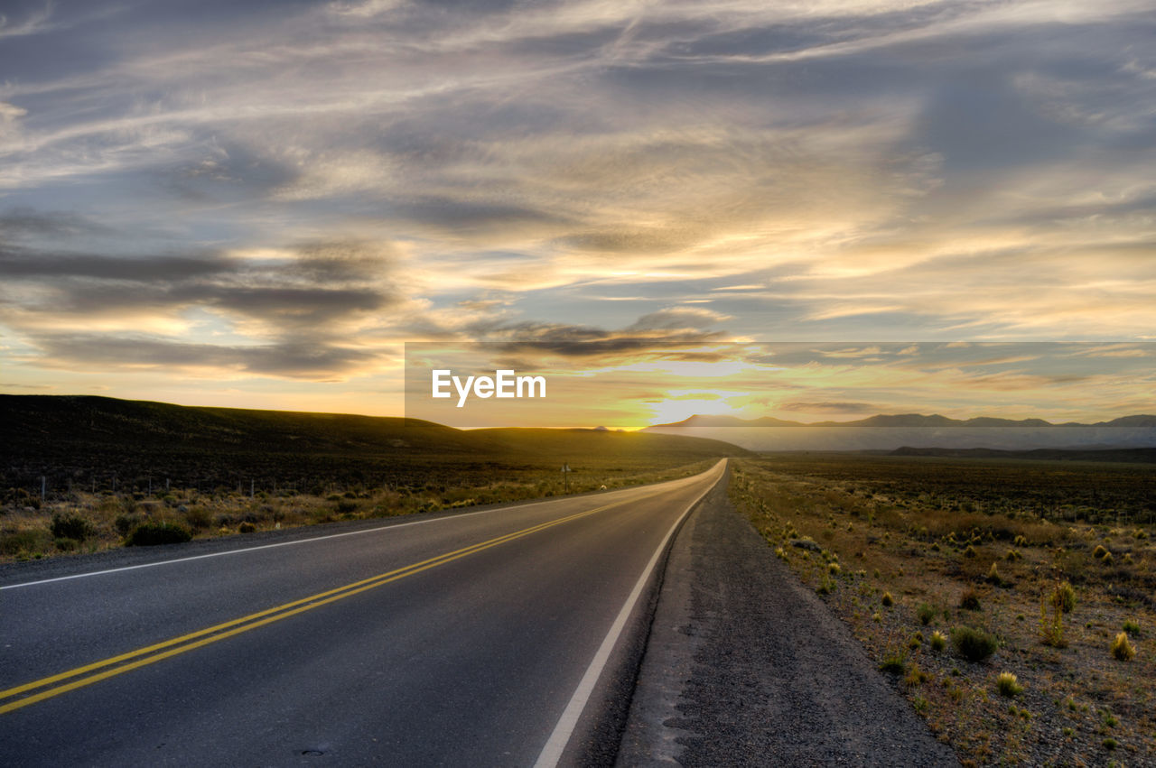 Road against sky during sunset