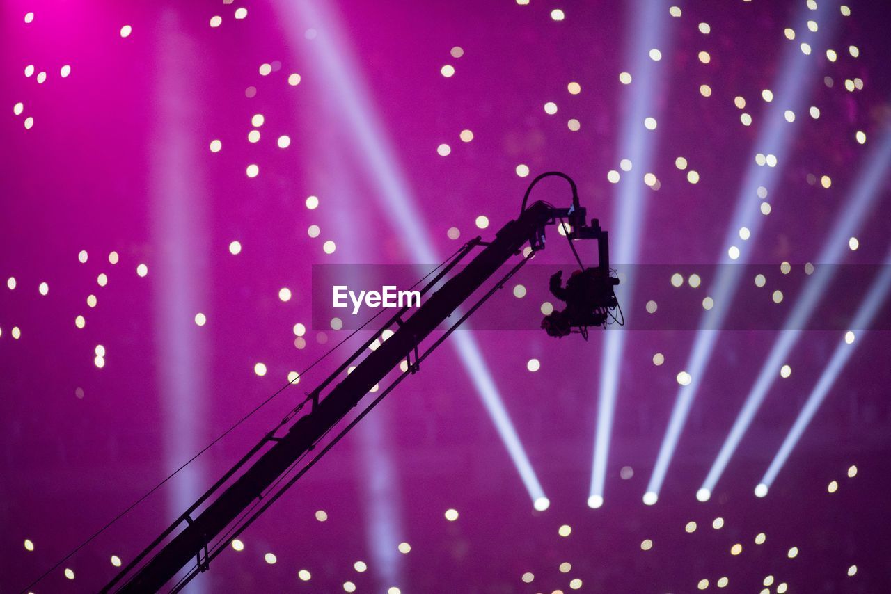 Low angle view of silhouette camera during concert