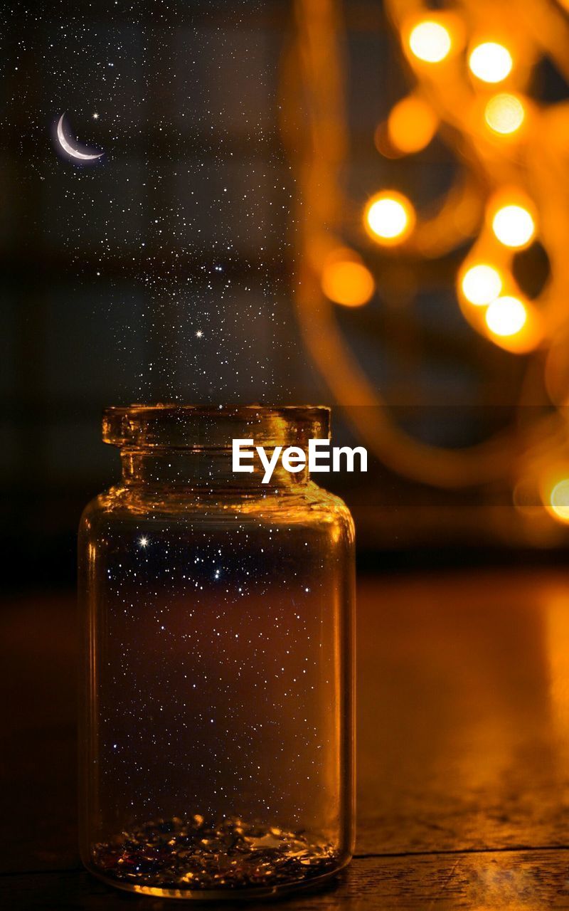 Close-up of glass bottle on table