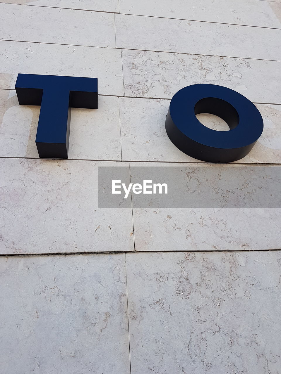 TEXT ON STONE WALL