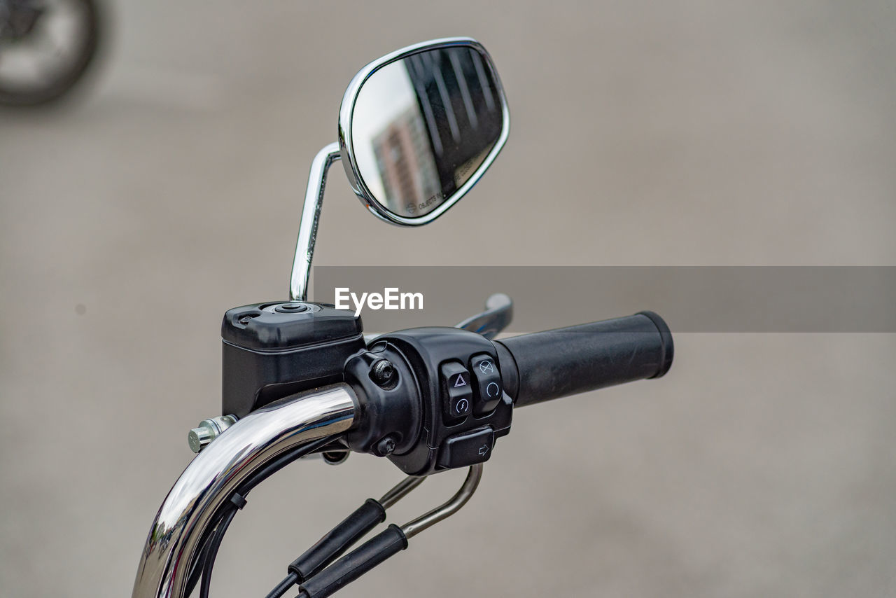 Motorcycle handlebar with chrome rear view mirror