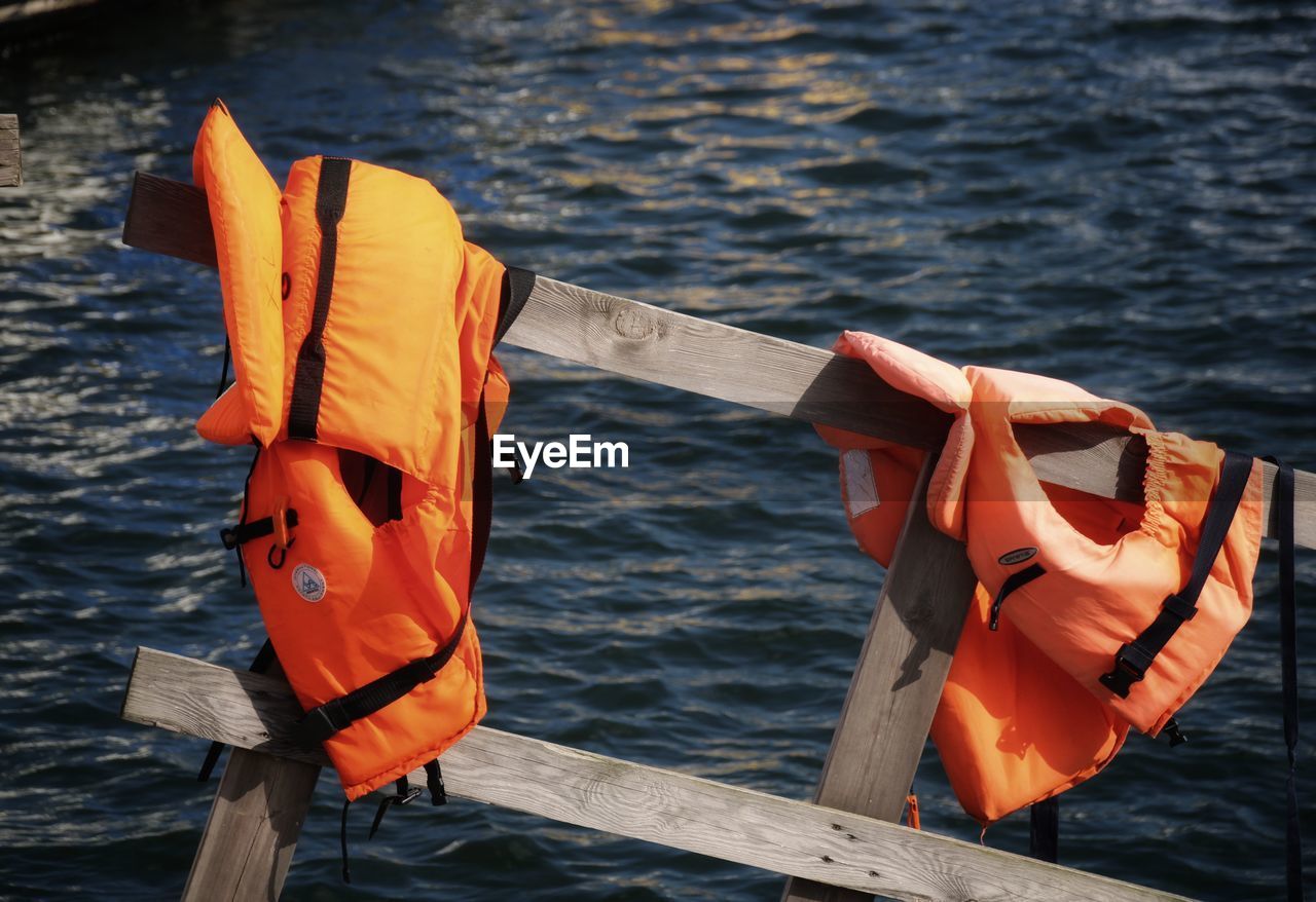 High angle view of  life vest on wooden post