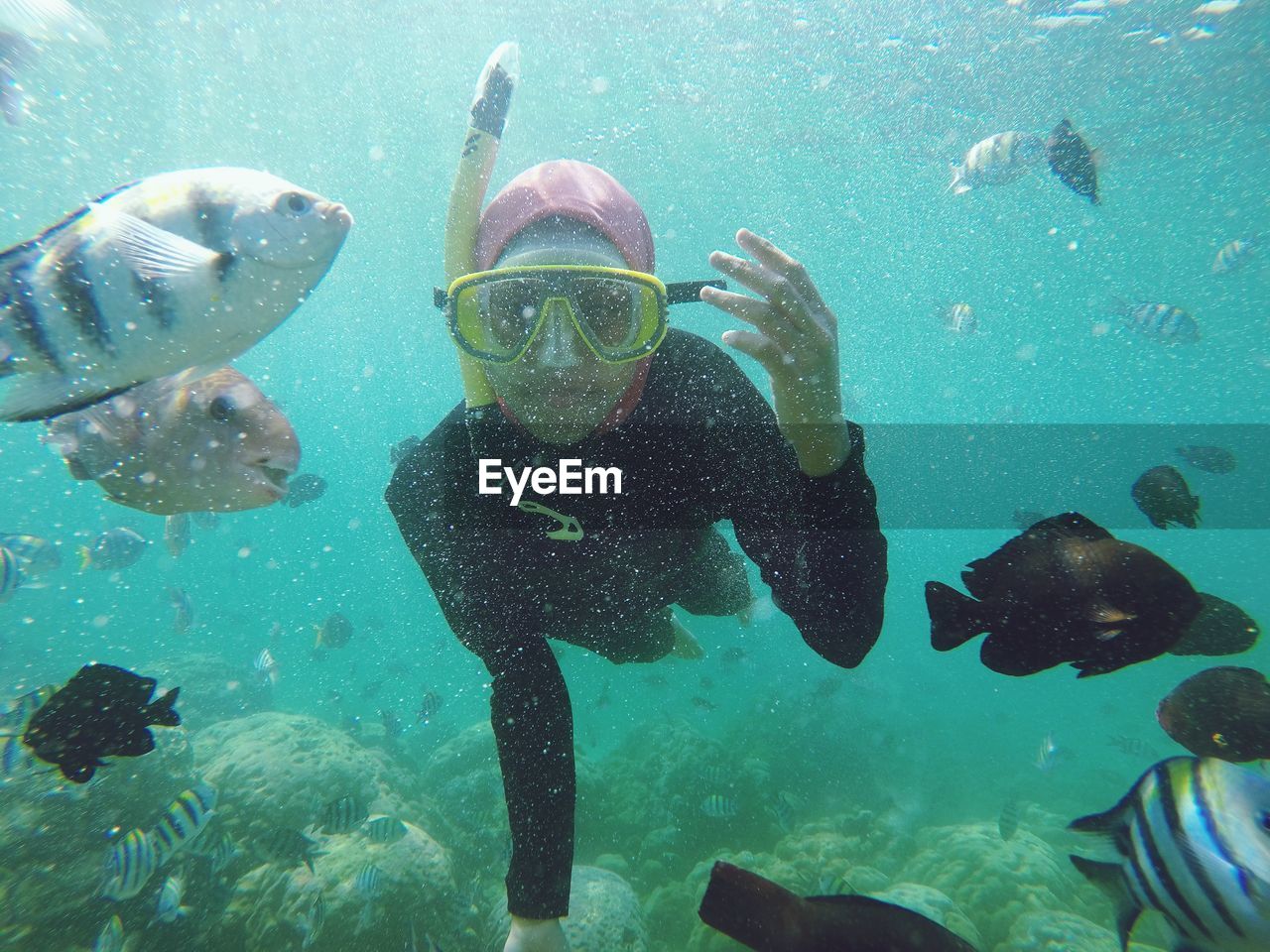 MAN SWIMMING UNDERWATER