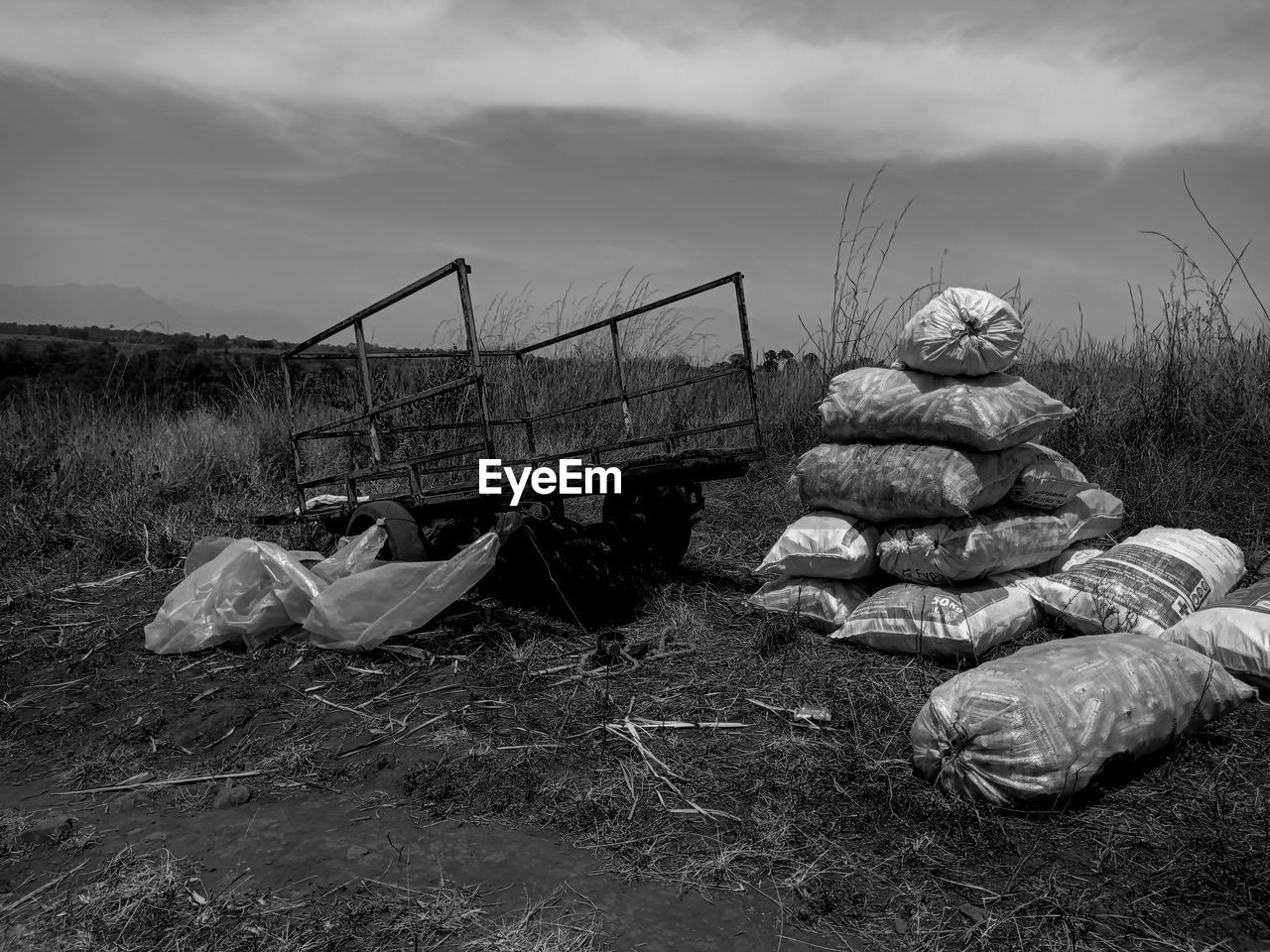 STACK OF DAMAGED STONES ON FIELD