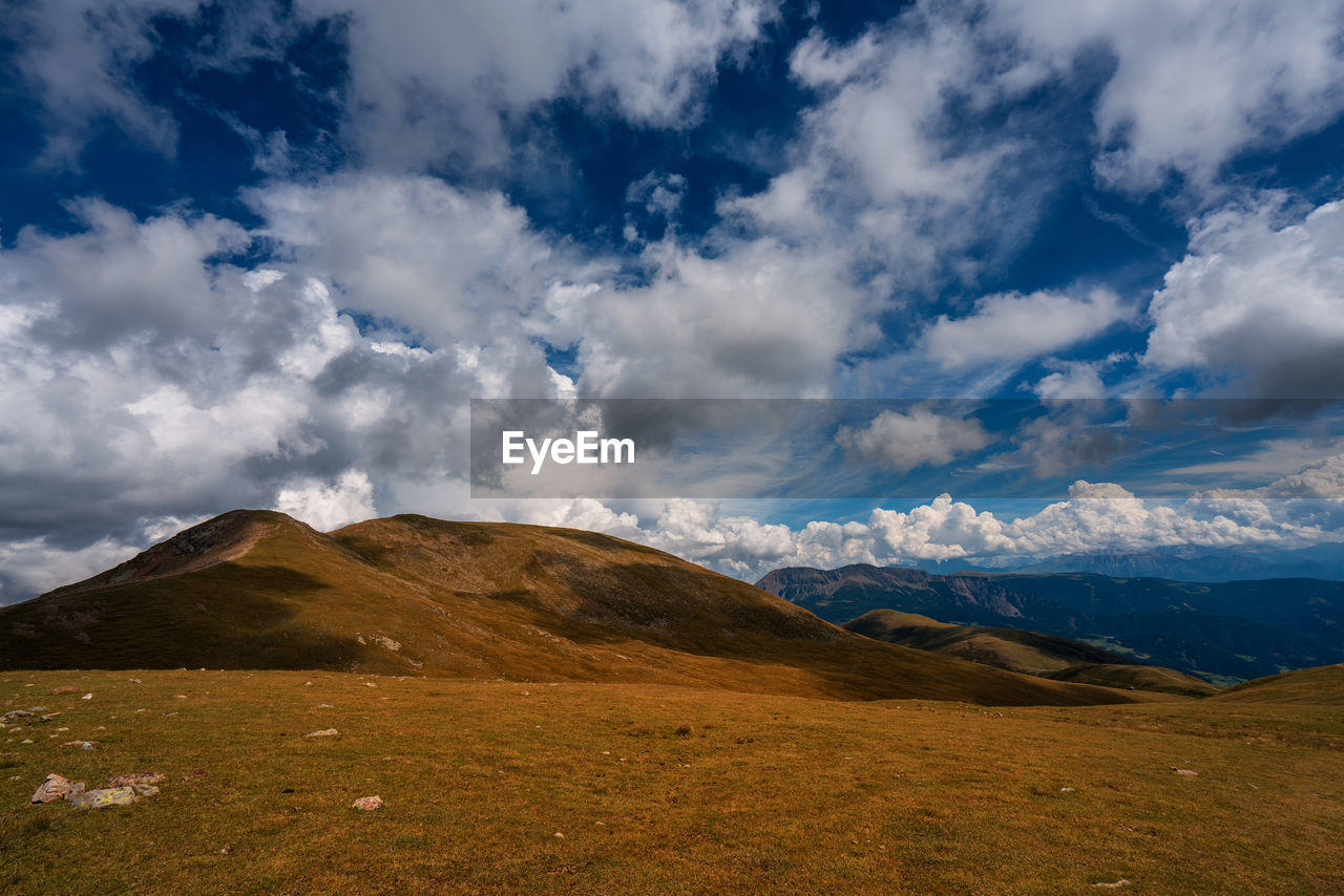 Scenic view of landscape and mountains against sky