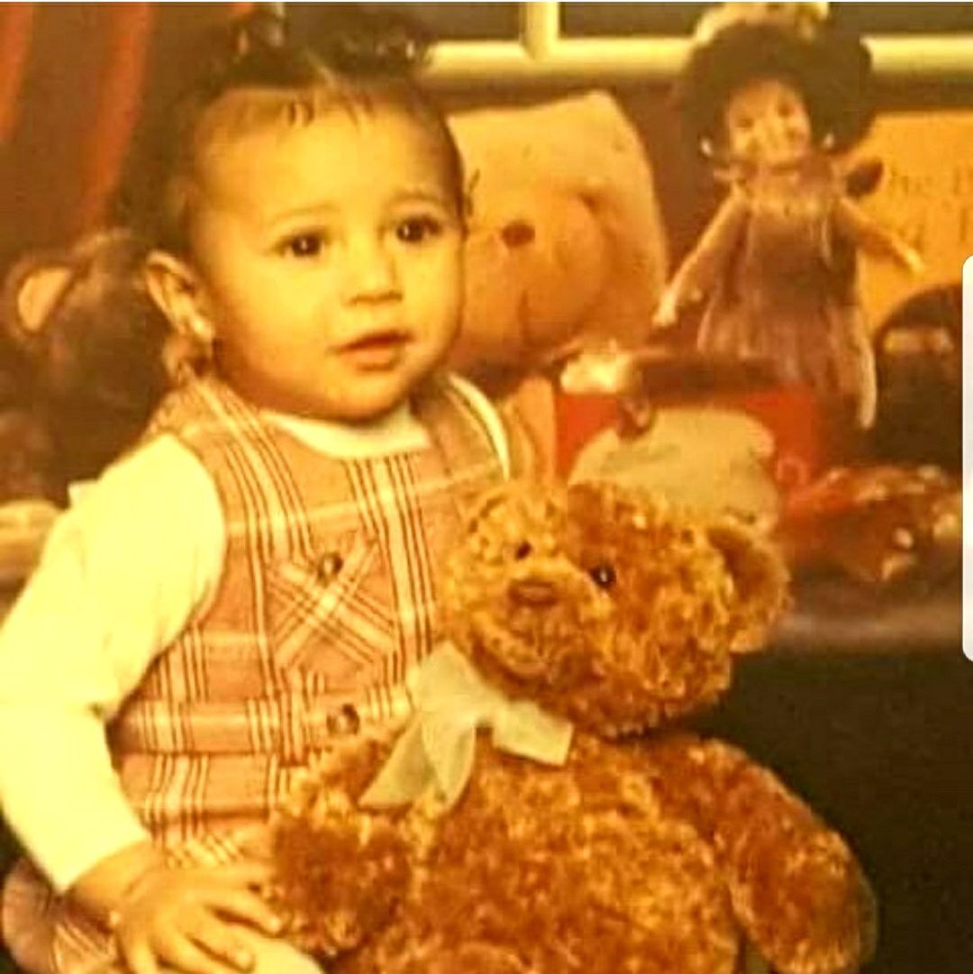 PORTRAIT OF CUTE GIRL WITH TOY IN TOYS