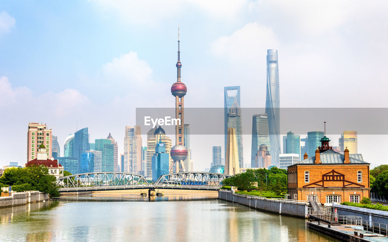 VIEW OF CITY BUILDINGS BY RIVER