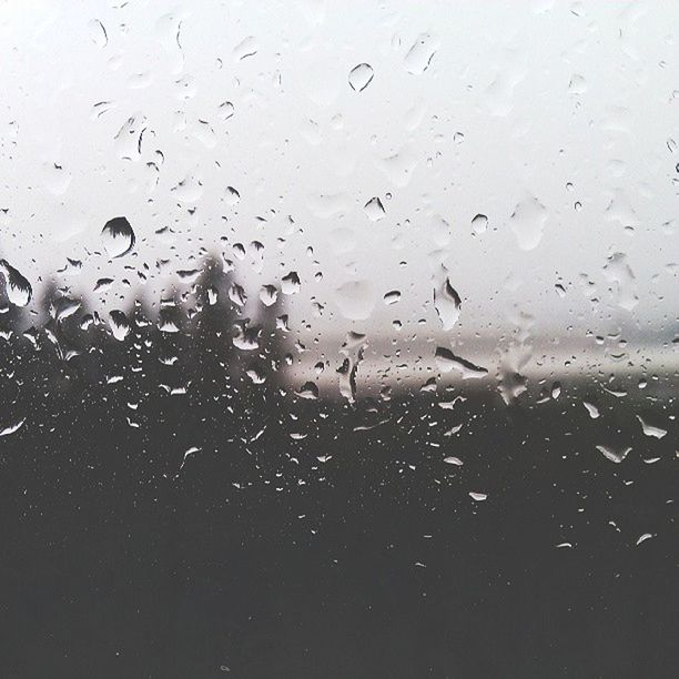 CLOSE-UP OF WATER DROPS ON WINDOW