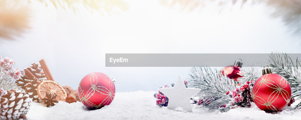 Close-up of christmas decorations on fake snow