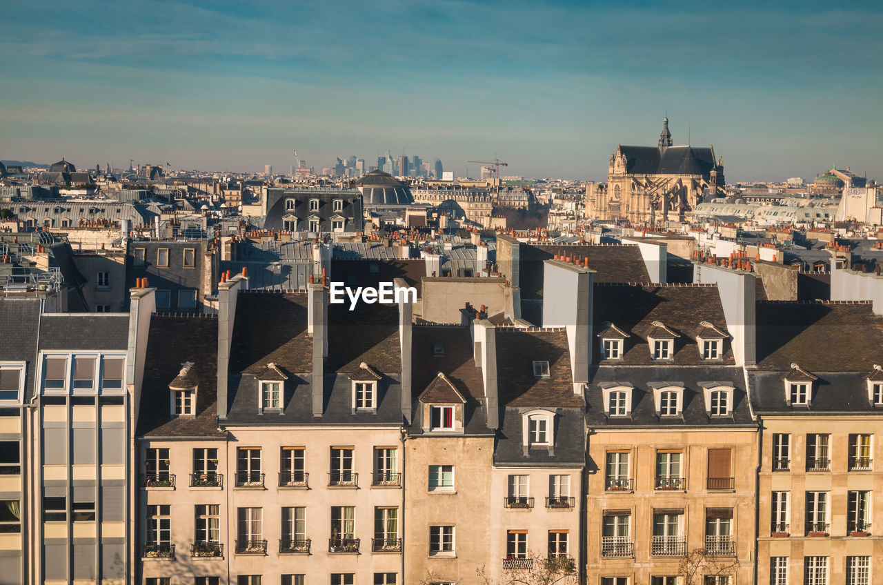 Buildings in city against sky