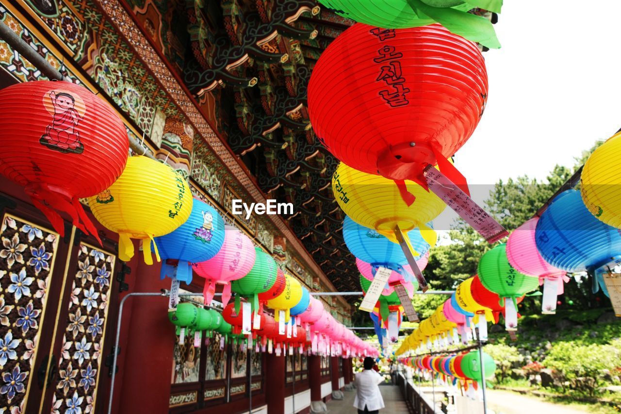 LOW ANGLE VIEW OF TRADITIONAL LANTERNS
