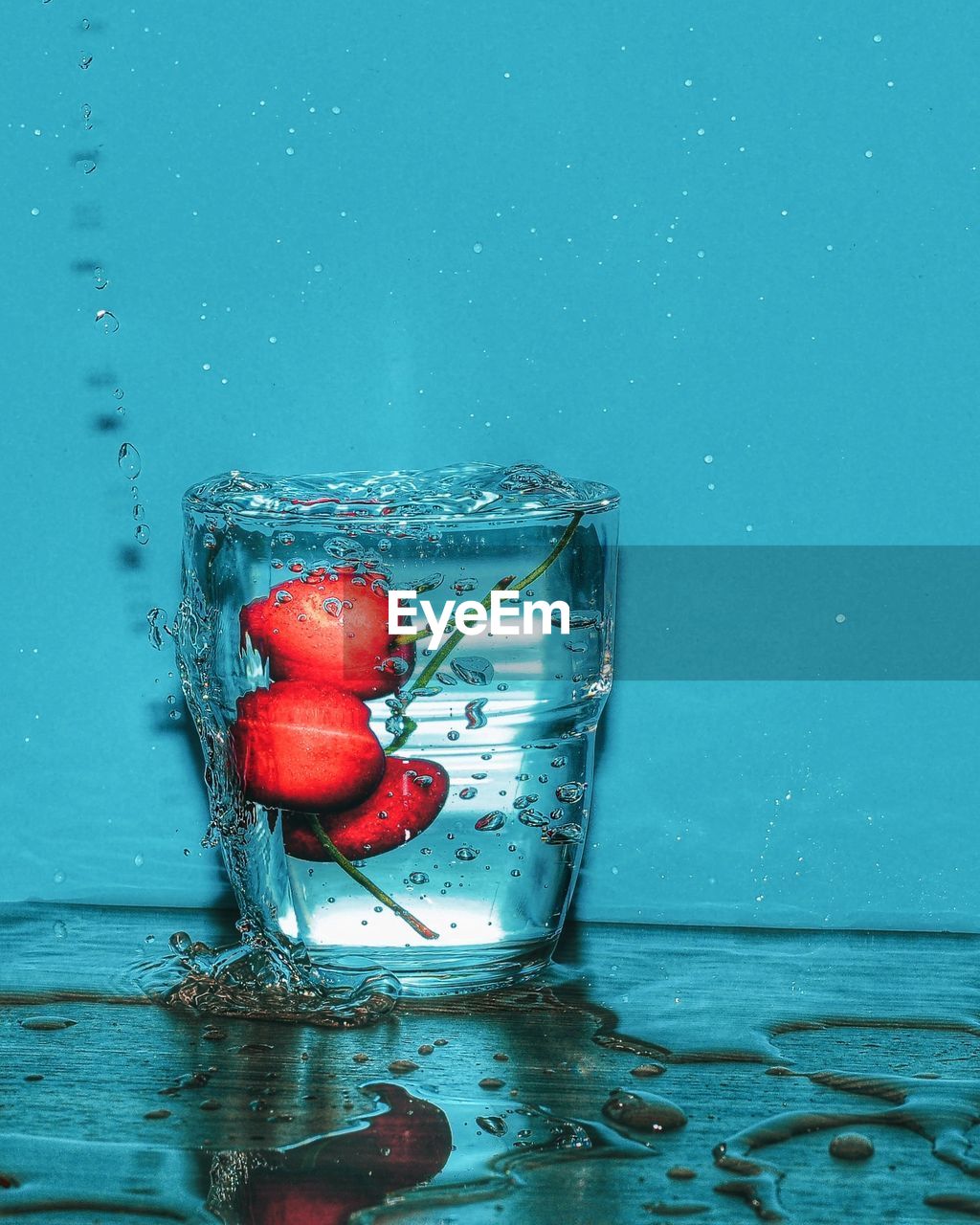 CLOSE-UP OF CHERRIES IN GLASS