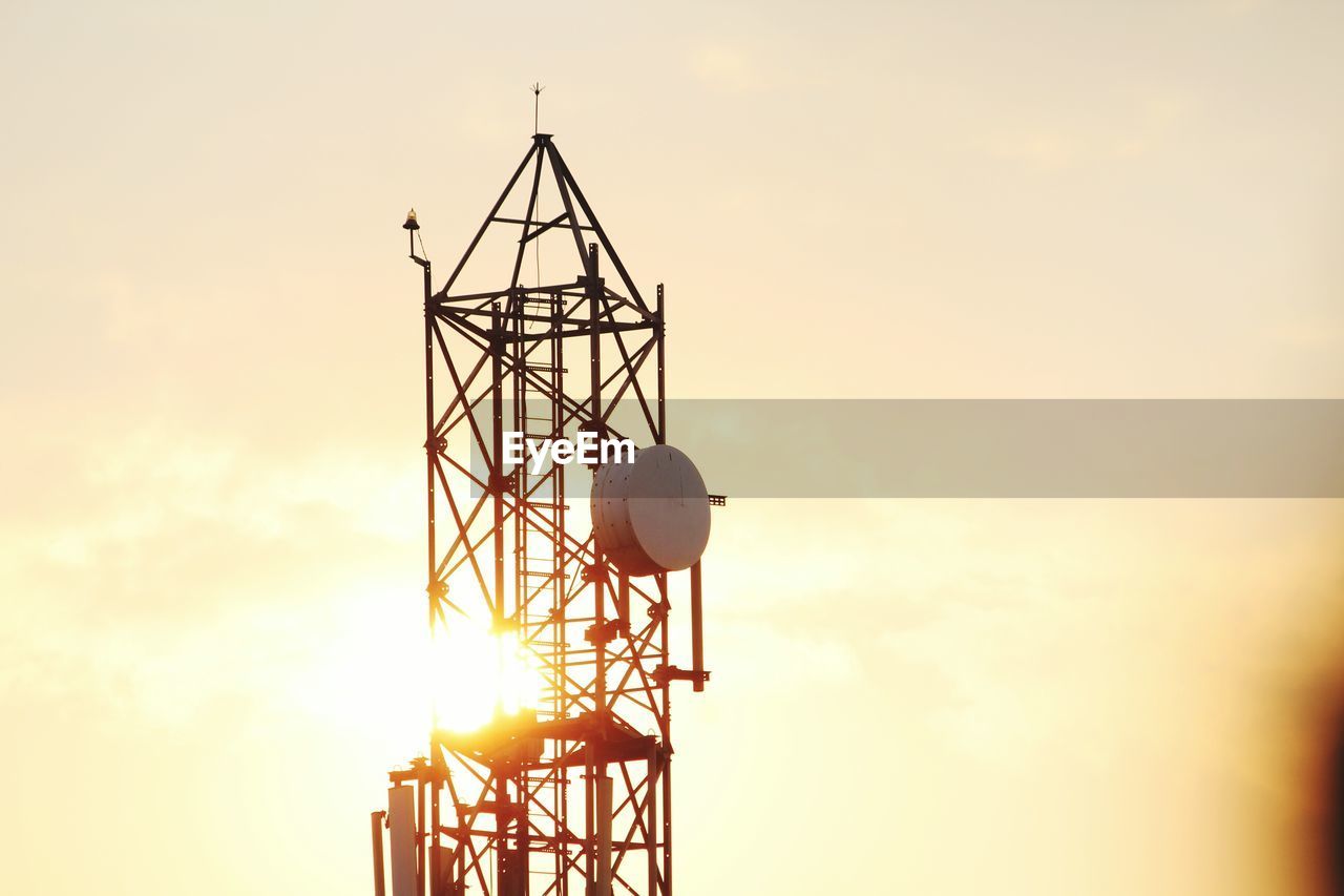 SILHOUETTE OF CRANE AGAINST SKY