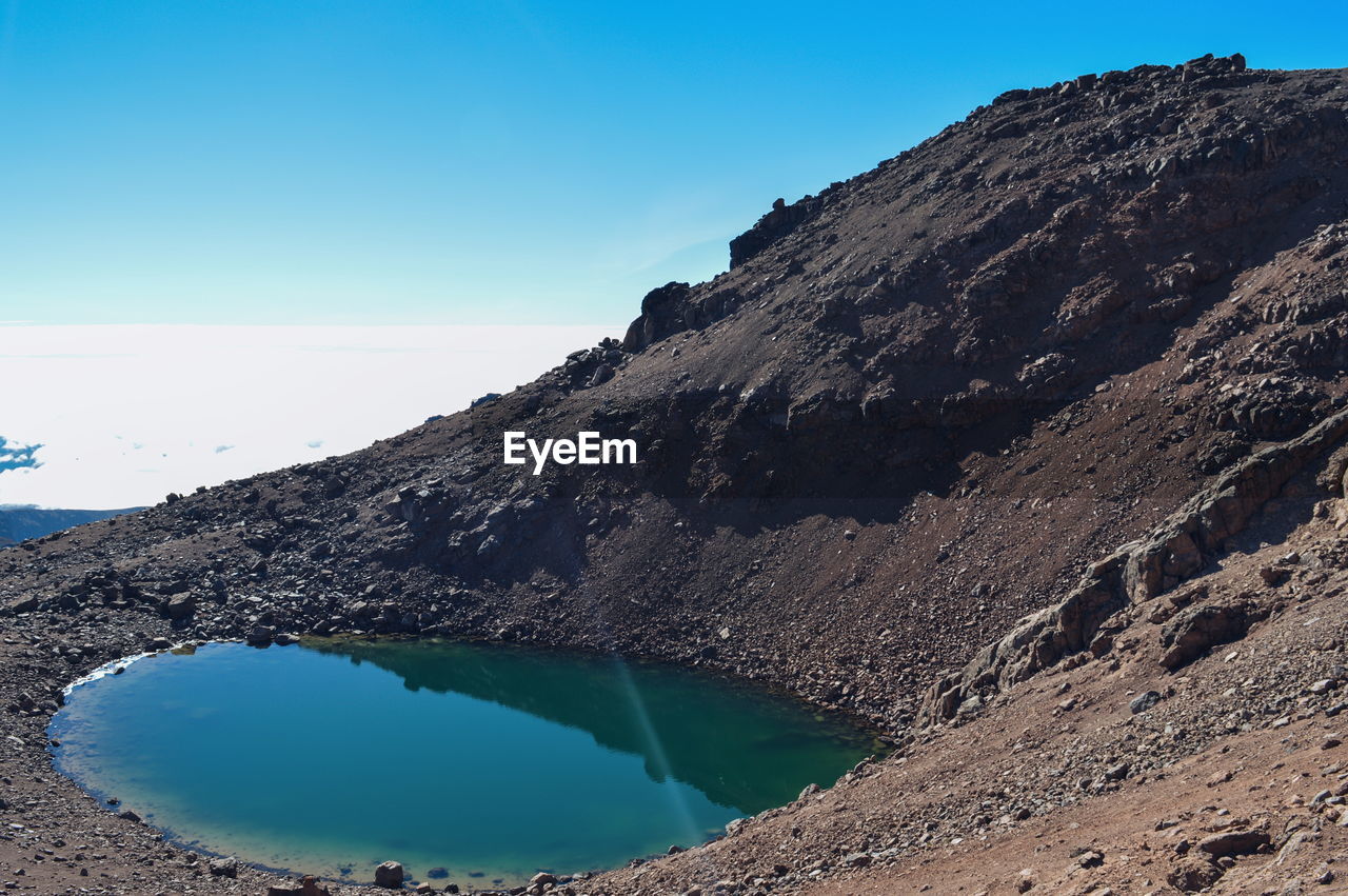 High altitude lake above the clouds at mount kenya, mount kenya national park, kenya