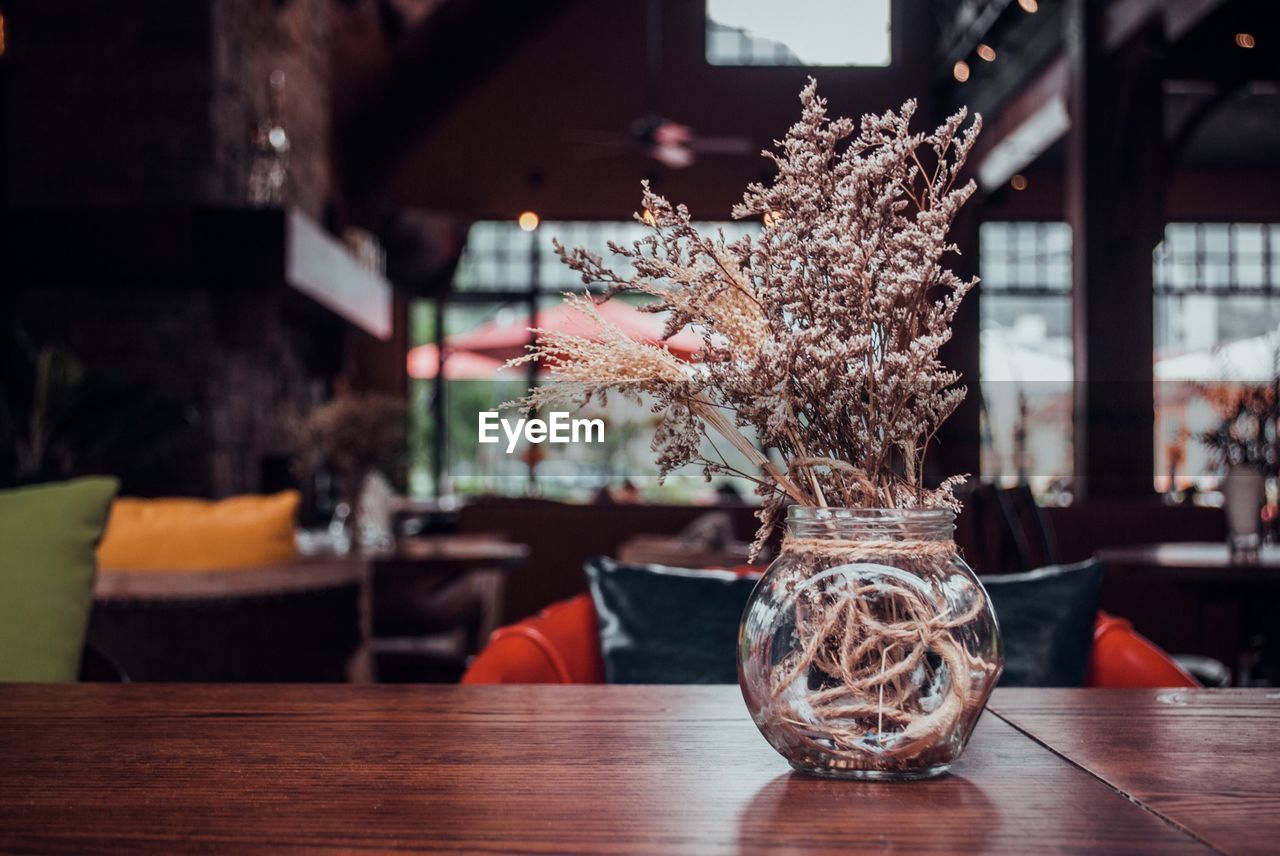 Close-up of flower vase on table