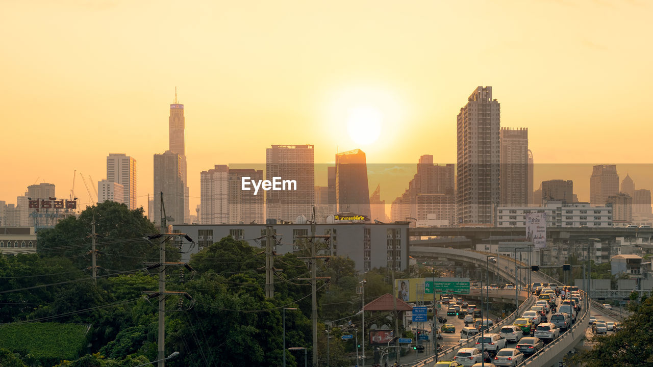 BUILDINGS IN CITY DURING SUNSET