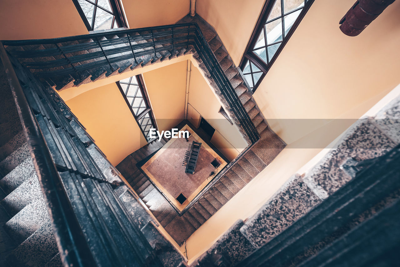 LOW ANGLE VIEW OF SPIRAL STAIRCASE OF BUILDING