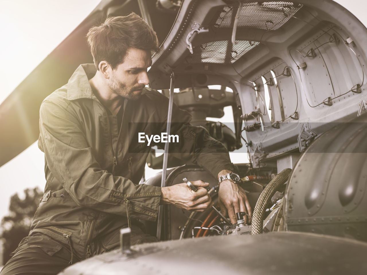 Mechanic repairing a helicopter