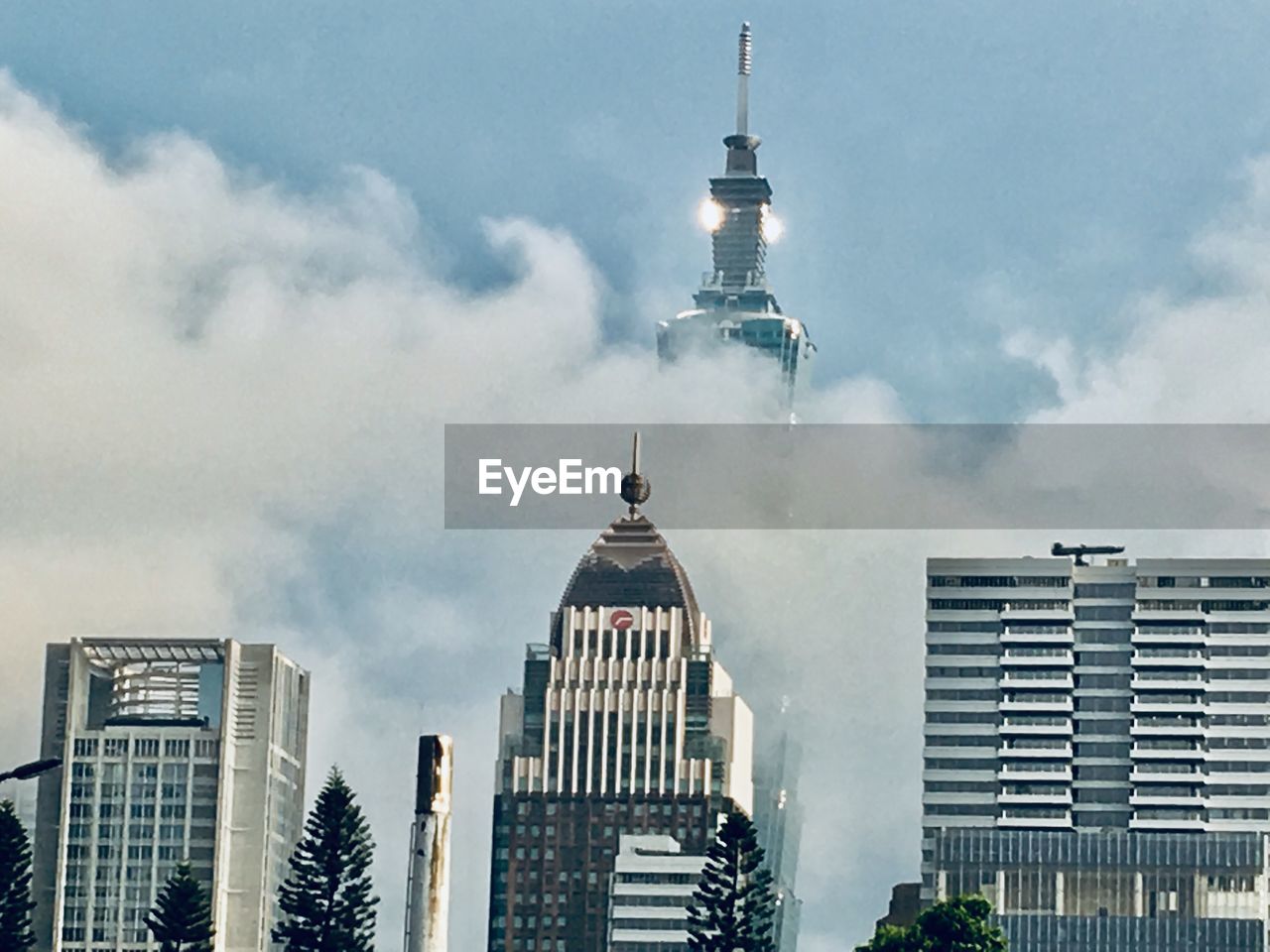 BUILDINGS IN CITY AGAINST SKY