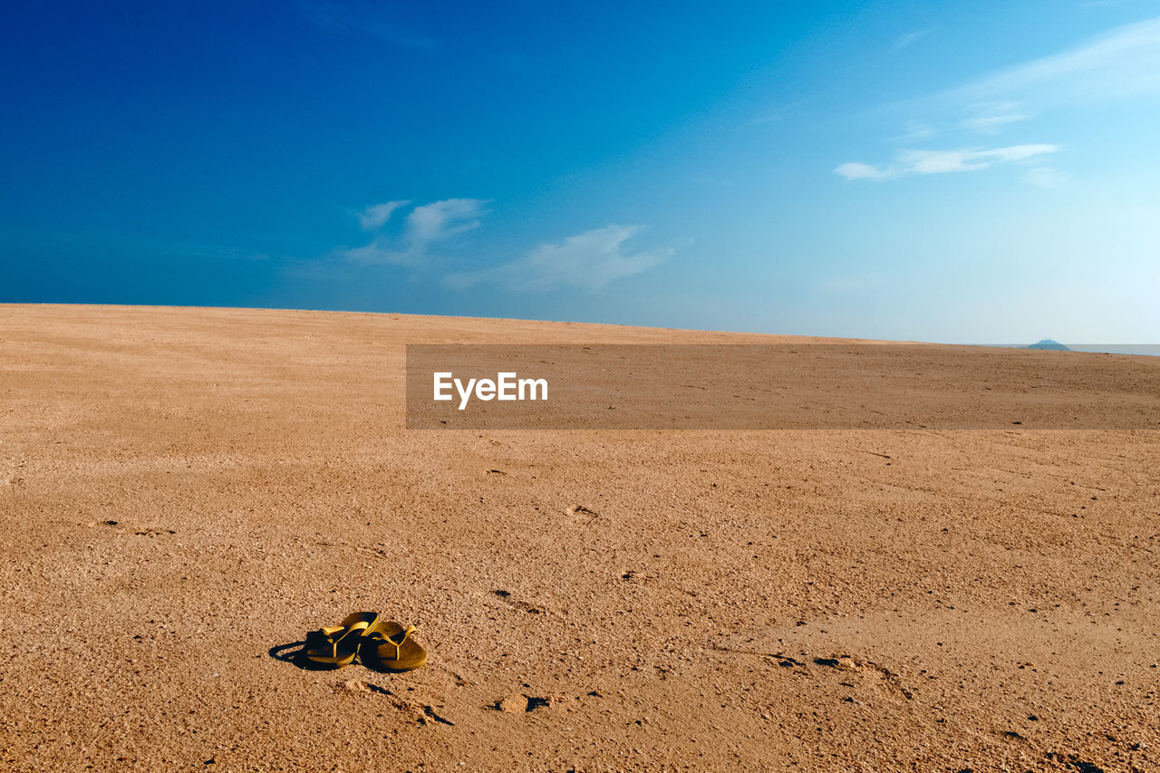 Scenic view of landscape against cloudy sky
