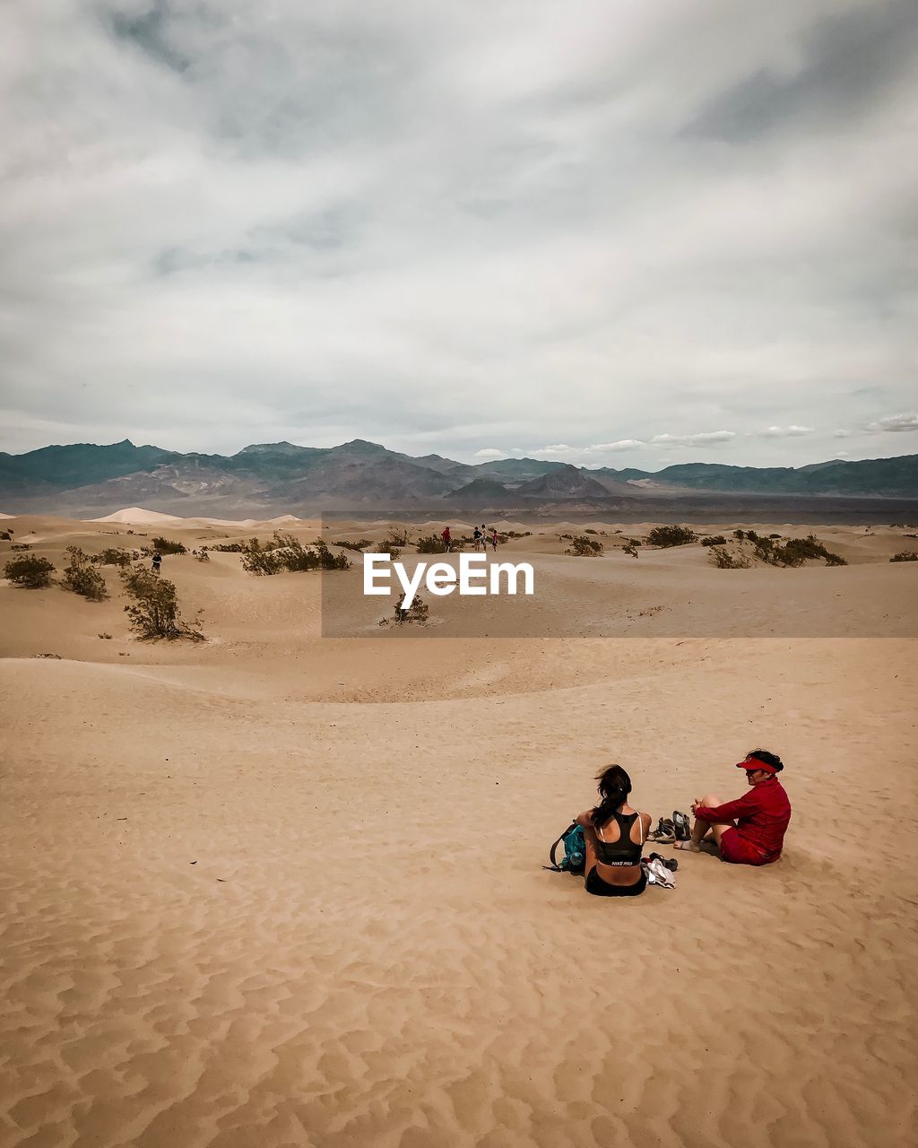 Women sitting at desert