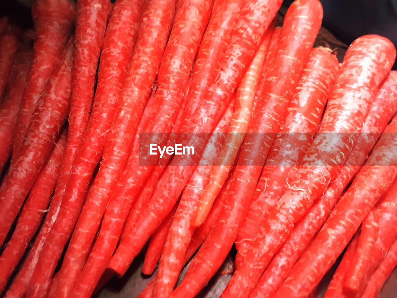 FULL FRAME SHOT OF RED CHILI PEPPERS IN CONTAINER