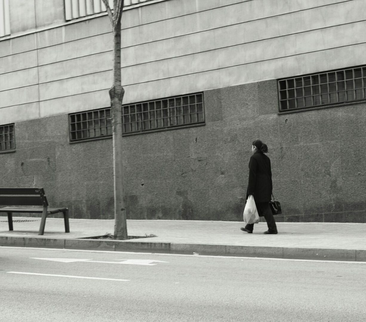 WOMAN WALKING IN CITY