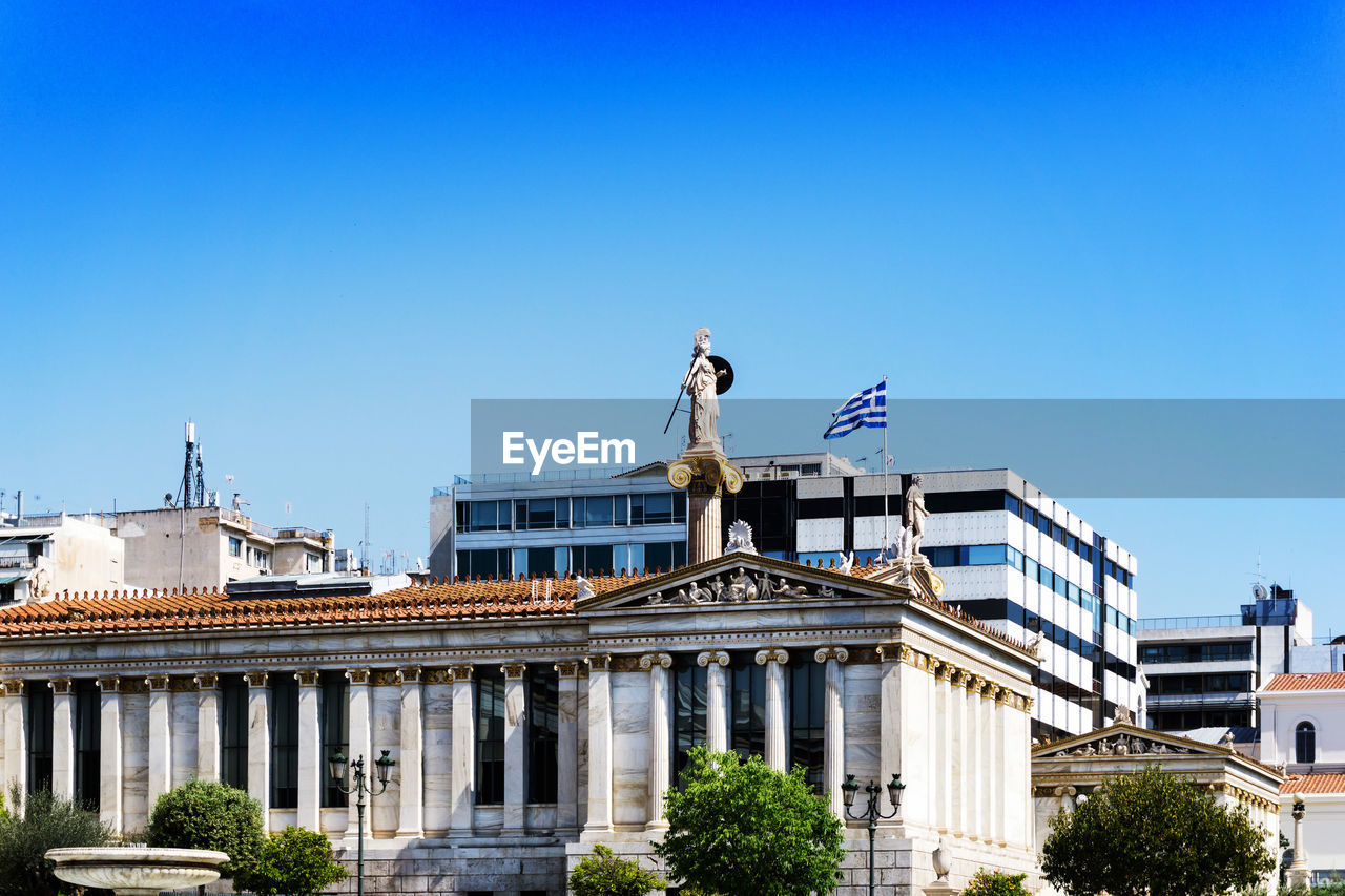 Low angle view of government building against clear blue sky