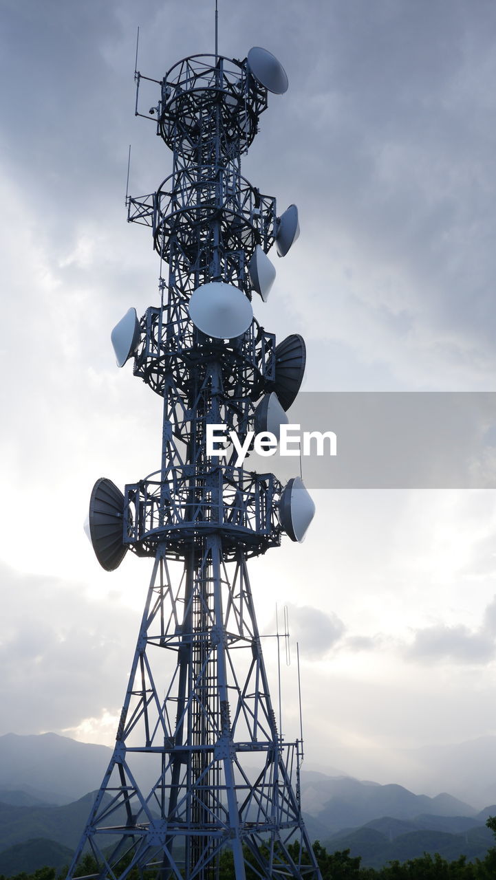 Low angle view of communication tower against sky