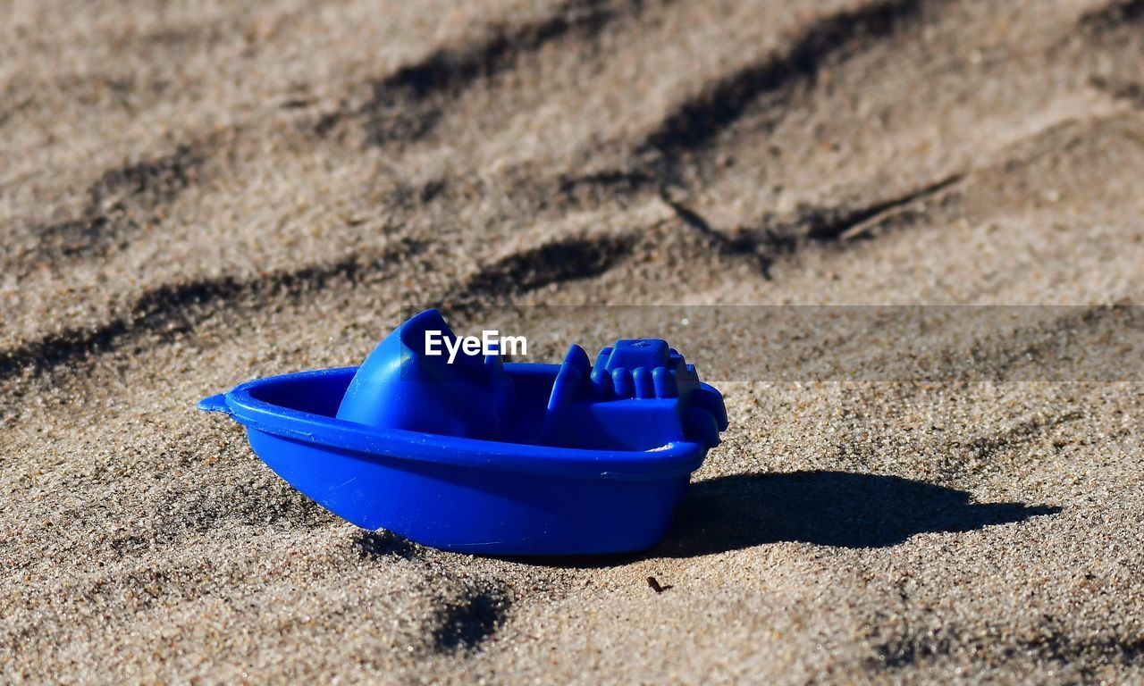 sand, blue, land, beach, sunlight, nature, shadow, no people, electric blue, day, outdoors, high angle view, water, close-up, absence