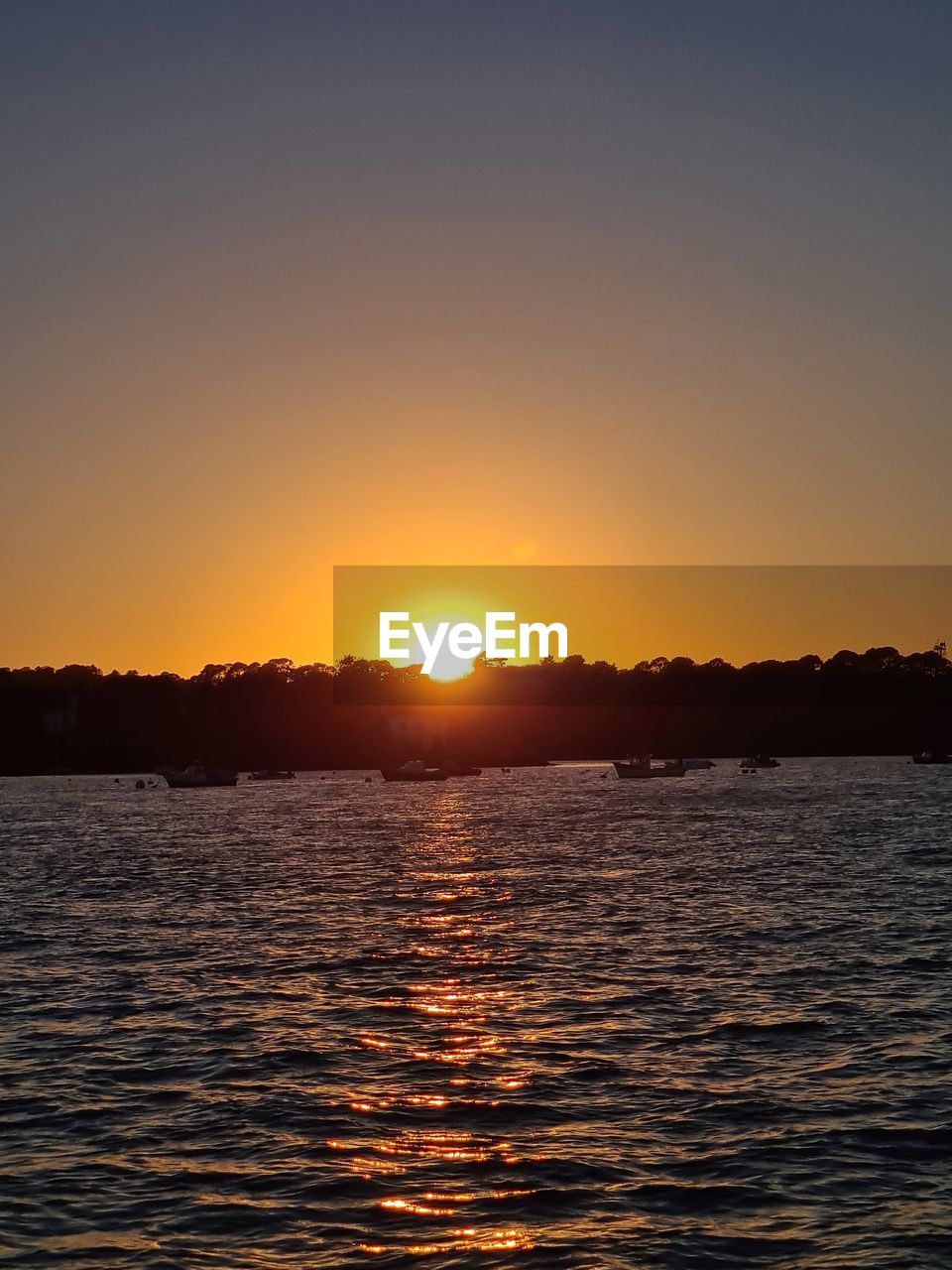 SCENIC VIEW OF SEA DURING SUNSET