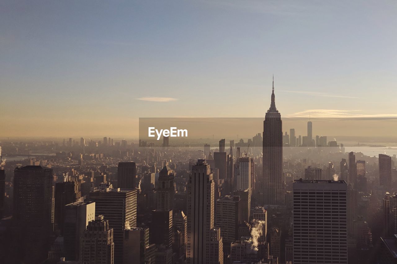 View of cityscape against sky during sunset