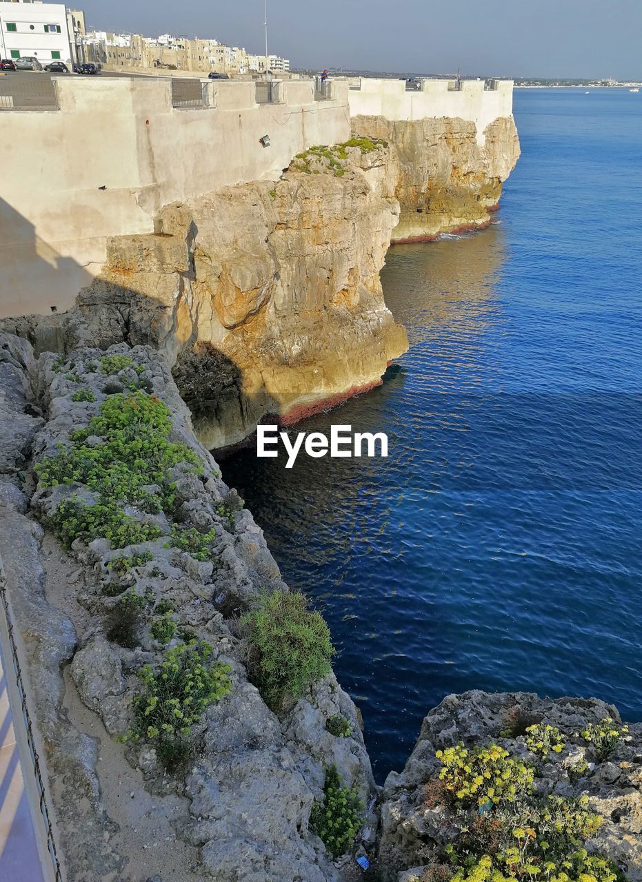 High angle view of rocks by sea