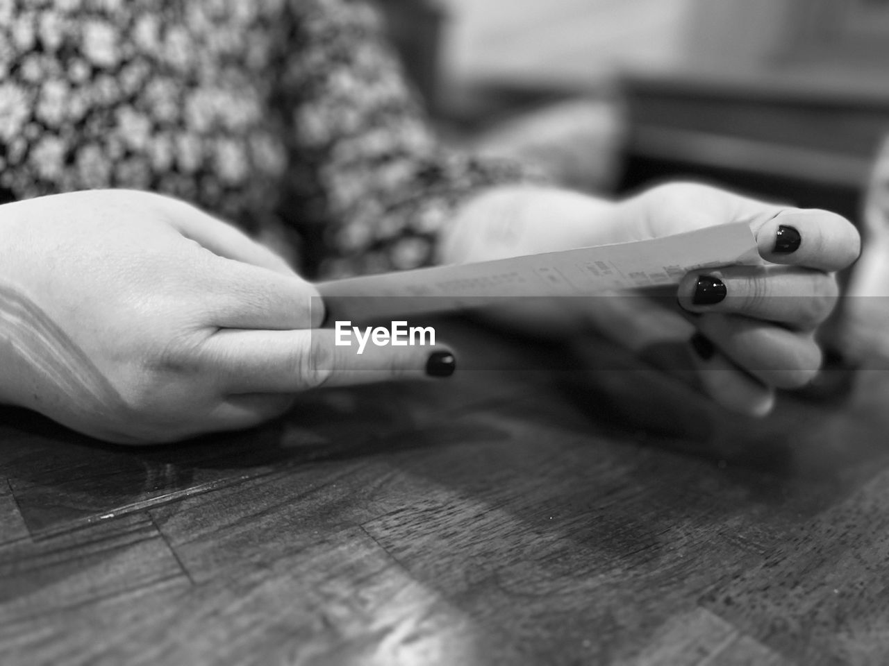 hand, finger, black and white, white, close-up, black, monochrome photography, monochrome, writing, one person, indoors, adult, holding, selective focus, wood, table, focus on foreground