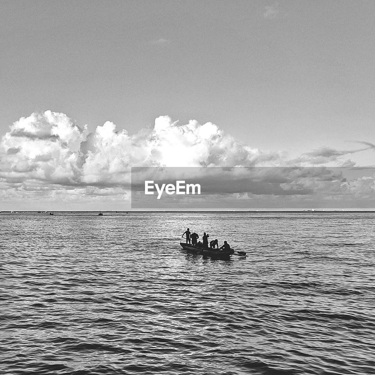 BOAT IN SEA AGAINST SKY