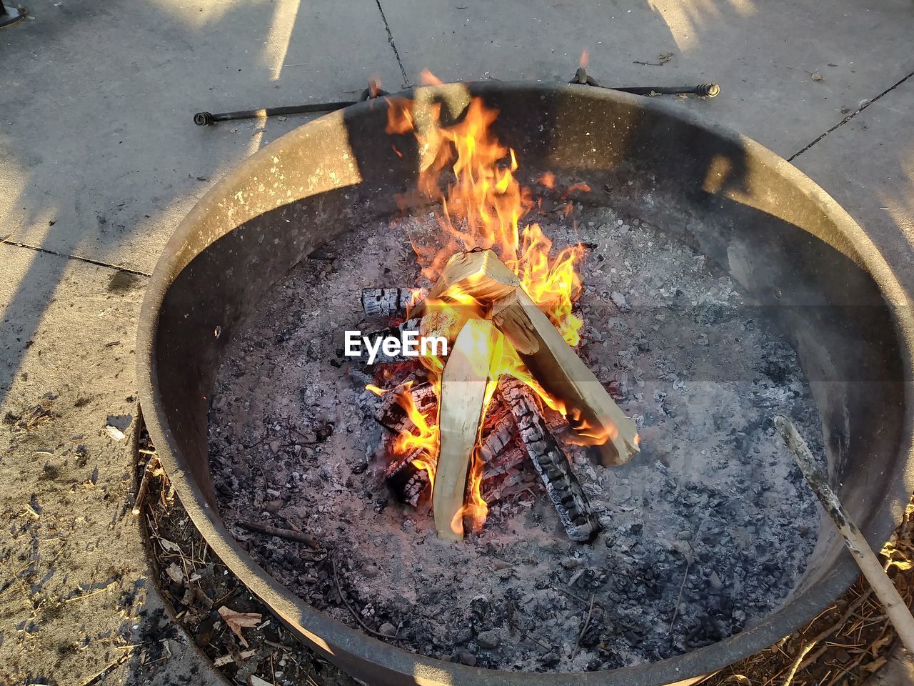 High angle view of fire on barbecue grill