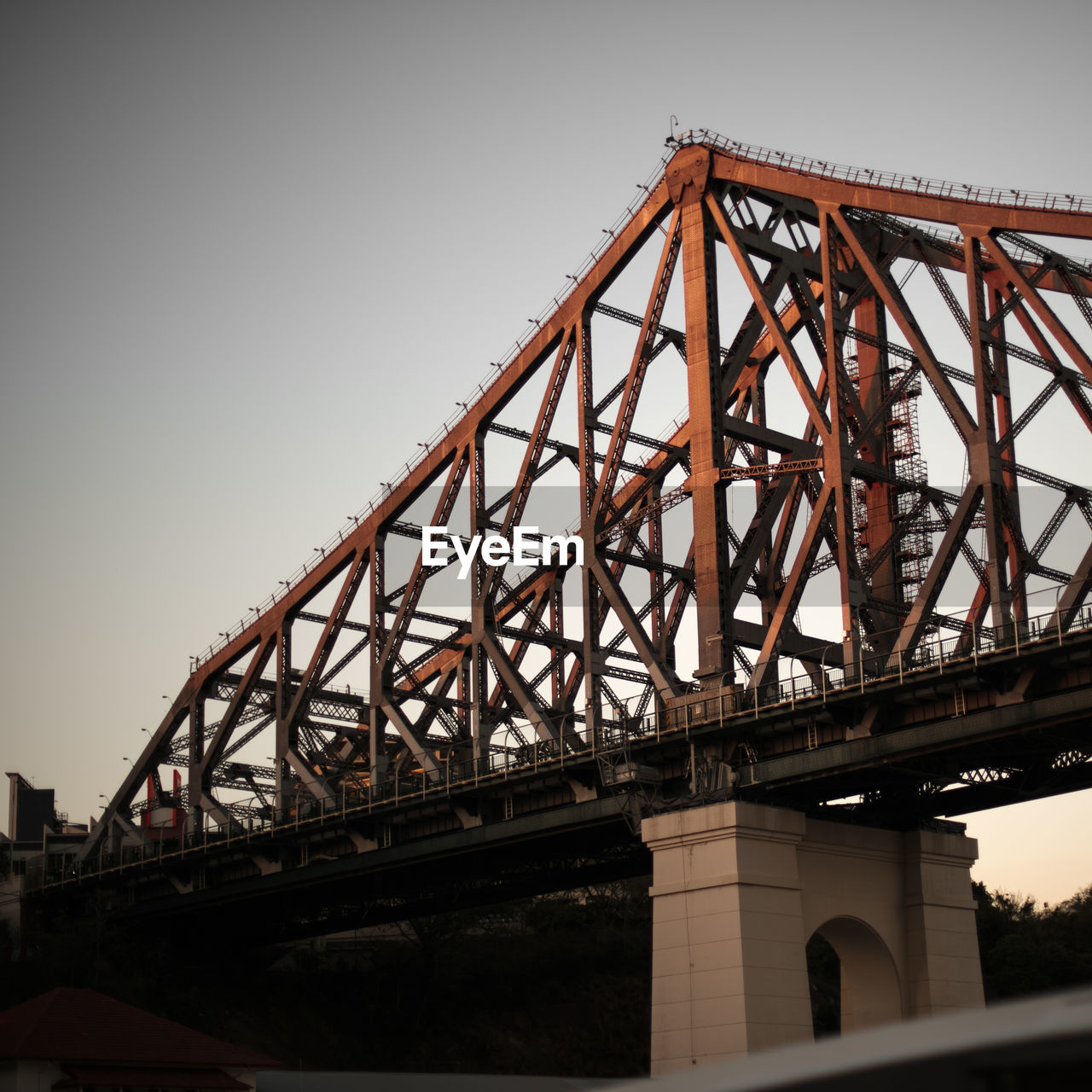 Low angle view of story bridge against clear sky