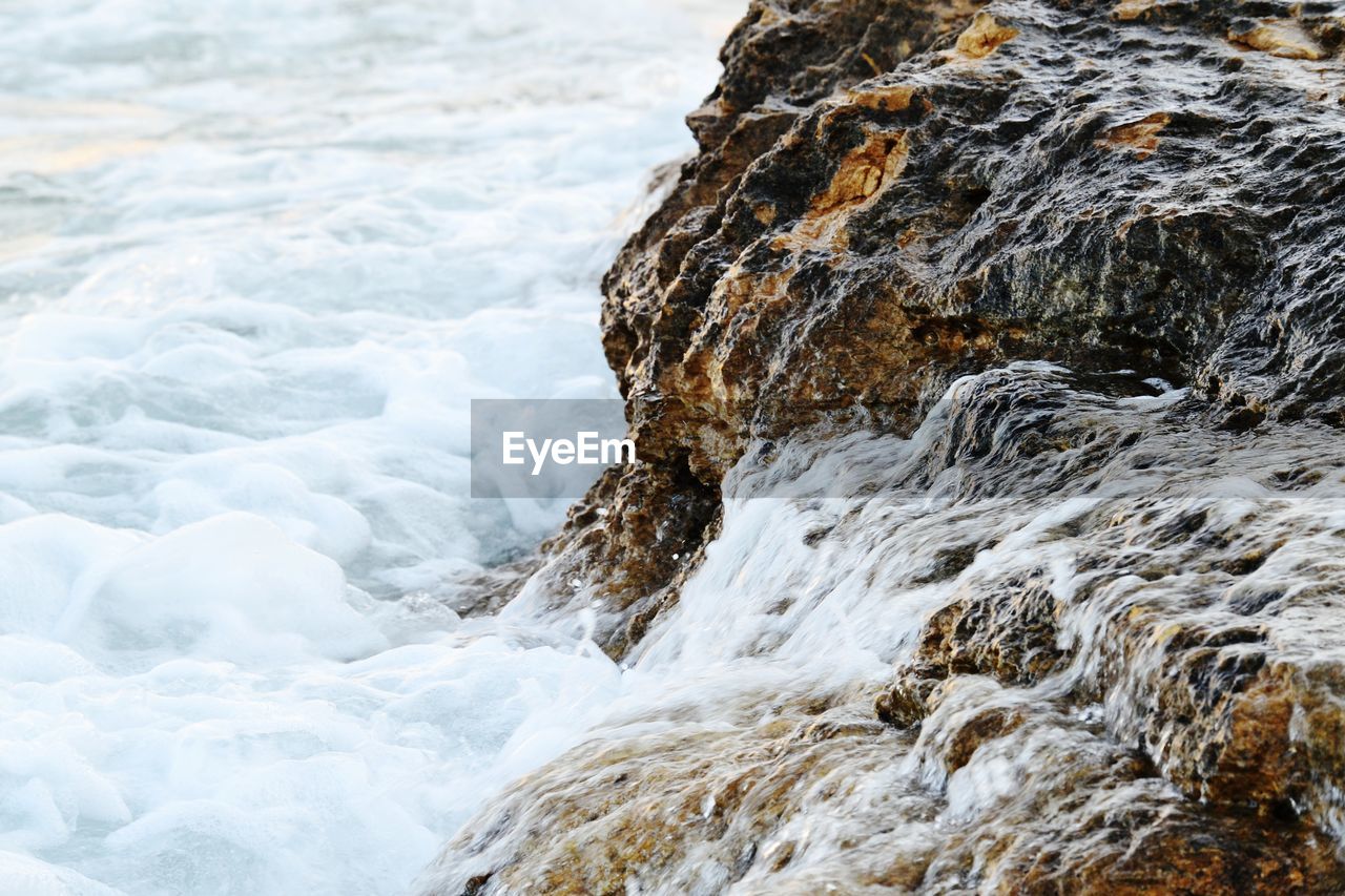 Sea waves splashing on rocks