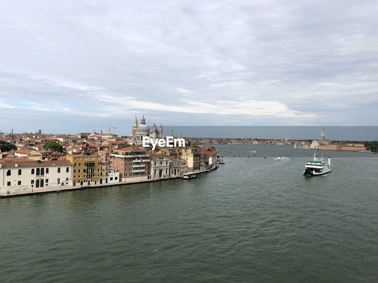 Scenic view of sea and buildings against sky