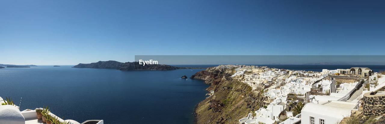 High angle view of sea against clear blue sky