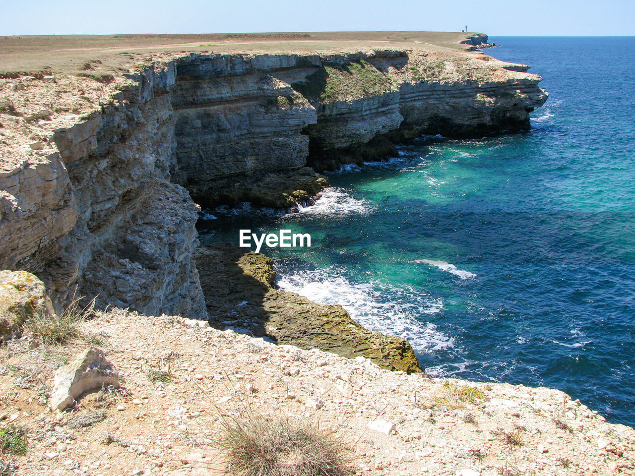 High angle view of rocks on sea shore