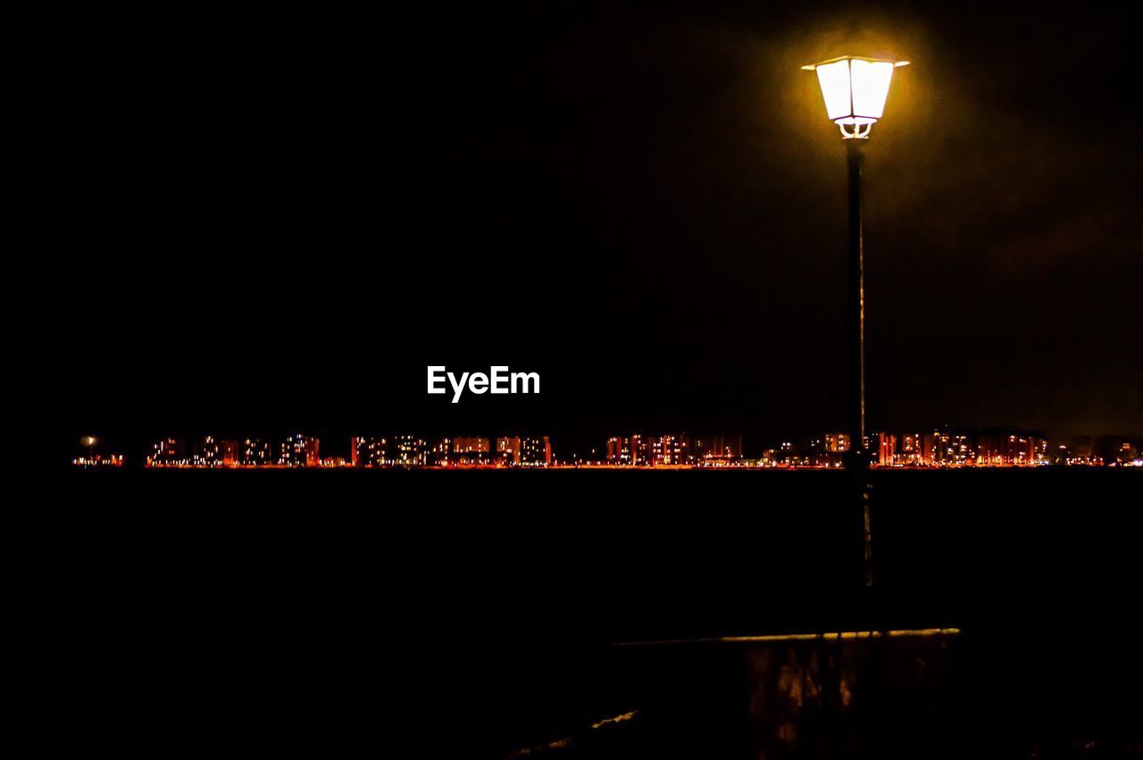 ILLUMINATED STREET LIGHT AT NIGHT