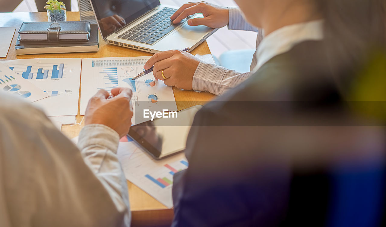 Businesswoman with colleagues working in office