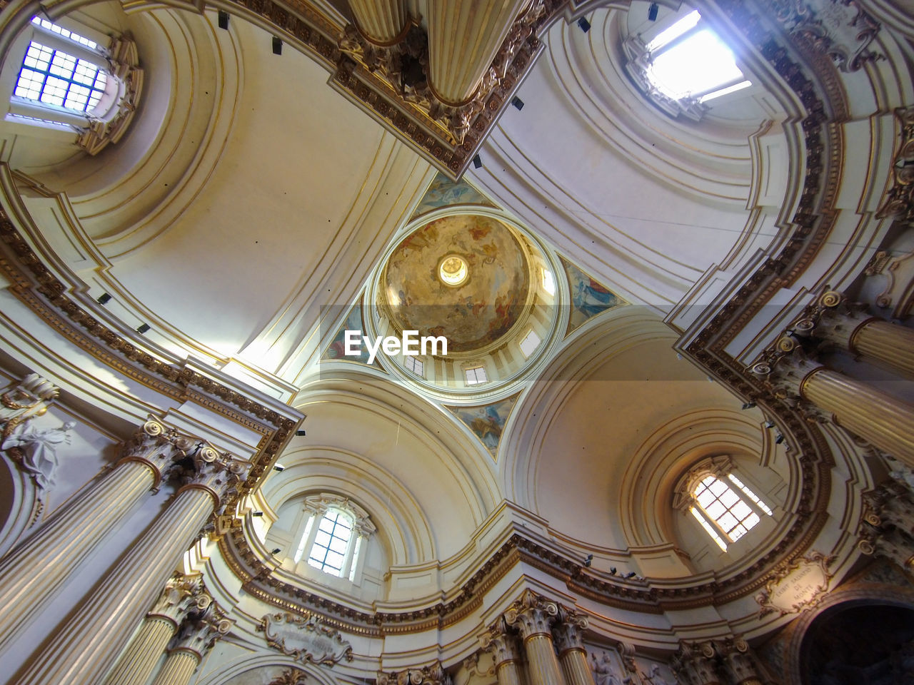 architecture, built structure, ceiling, dome, indoors, religion, low angle view, place of worship, no people, building, catholicism, belief, worship, spirituality, ornate, history, the past, travel destinations, architectural column, architectural feature, arch, cupola, directly below, day